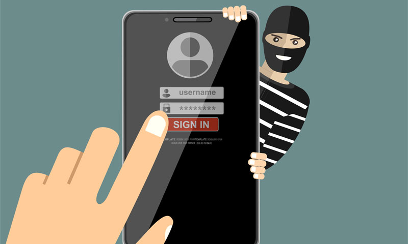 Adathalászat, illusztráció: adathalász hekker maszkban mobiltelefonról lop adatokat